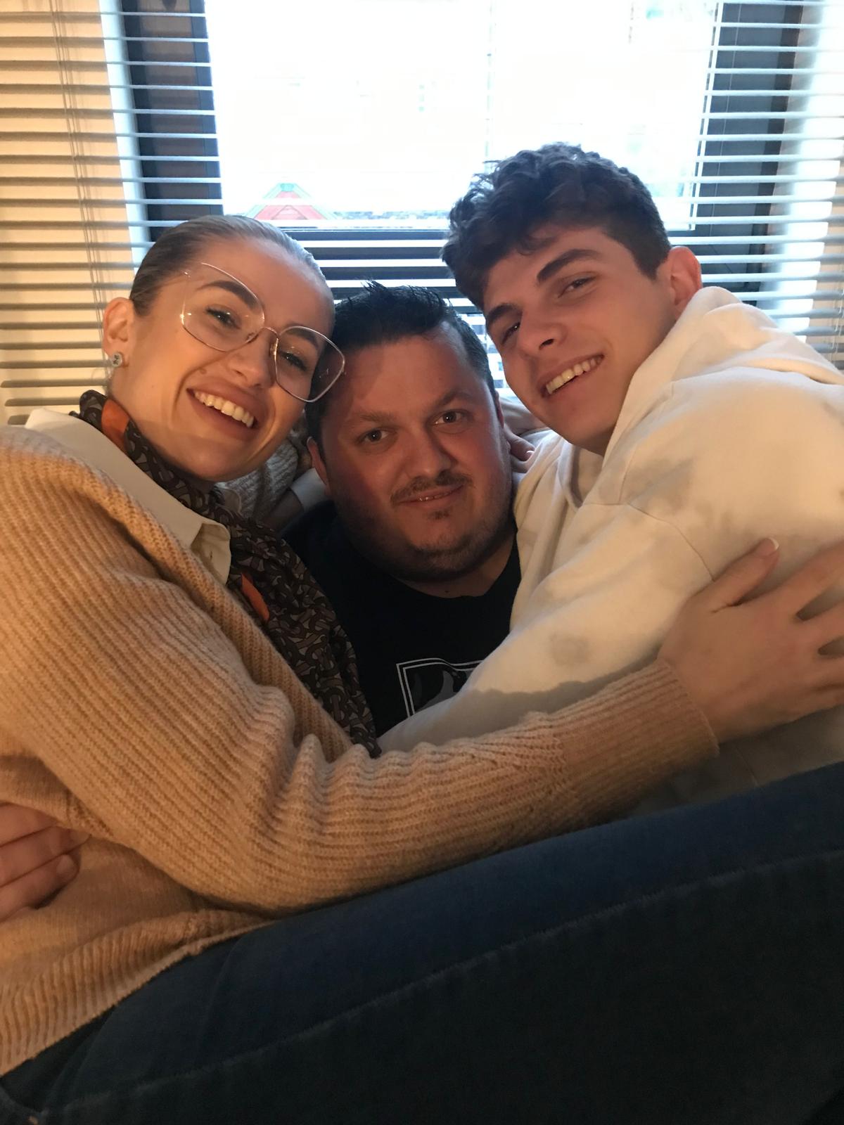 Chris, Tobias and Jess Hugging